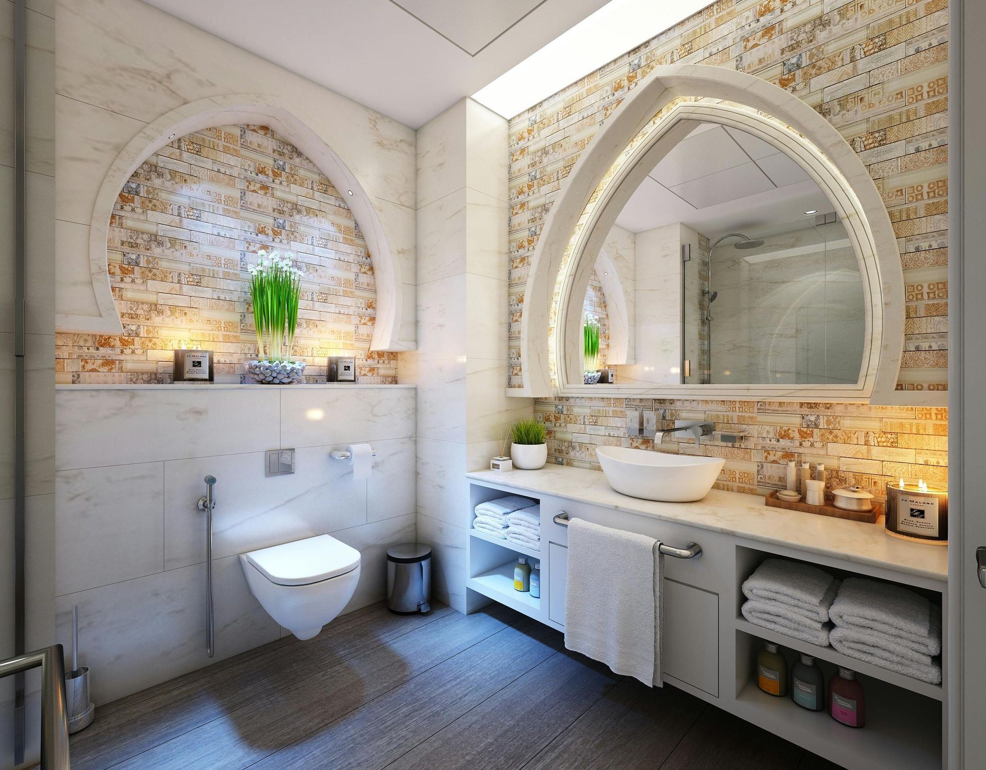 Remodeled bathroom with a custom arched vanity mirror