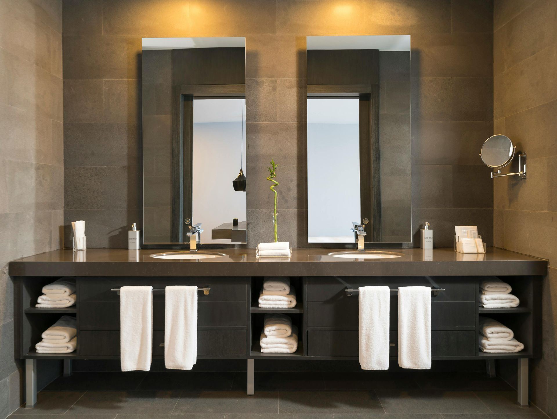 Modern bathroom with a double vanity and two large mirrors.