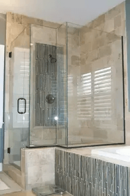 Custom frameless glass shower installation in a remodeled bathroom